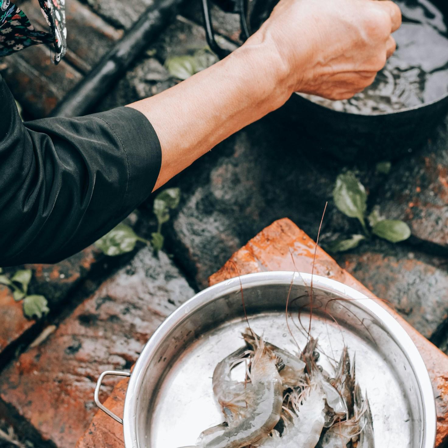 Community members collaborating in a modern kitchen space, sharing recipes and cooking techniques